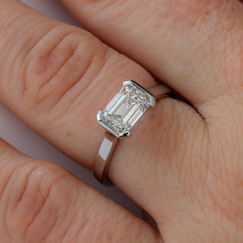 East-West Half Bezel Emerald Cut Diamond Engagement Ring