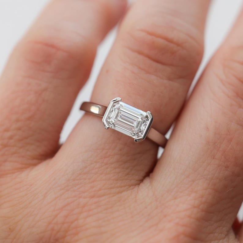 East-West Half Bezel Emerald Cut Diamond Engagement Ring