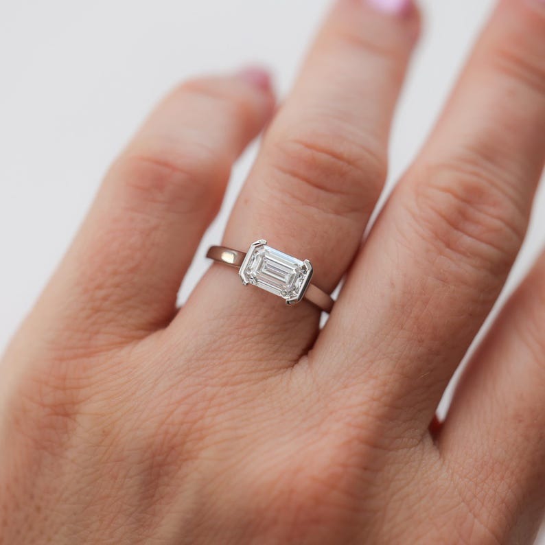 East-West Half Bezel Emerald Cut Diamond Engagement Ring