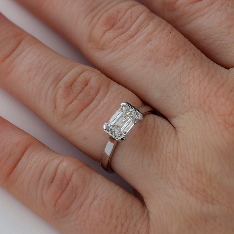 East-West Half Bezel Emerald Cut Diamond Engagement Ring